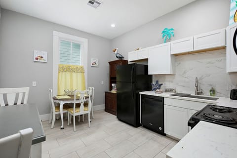 Large open kitchen with dining table seating up to 4.
Additional breakfast table seating for 2.