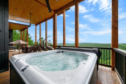 Soak in the hot tub while taking in breathtaking mountain views all around you. It's the perfect way to unwind, day or night.