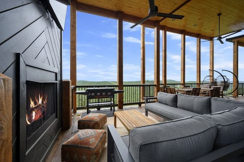 Kick back on the expansive back decks featuring cozy seating areas, outdoor fireplaces, mounted TVs, a Blackstone griddle, hot tub, and barrel sauna. It’s all set up for relaxing mornings, laid-back afternoons, and unforgettable evenings.