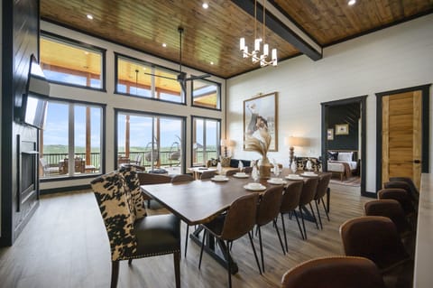 Gather around the custom live edge dining table where everyone can dine together in comfort and style, all while enjoying the incredible mountaintop views that surround the space.