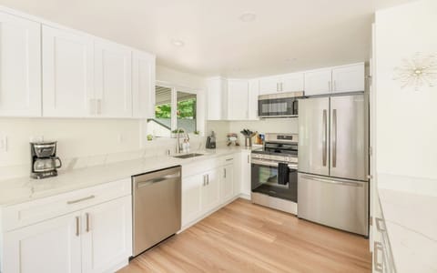 - Modern kitchen with stainless steel appliances and light  
- Bright cabinets and spacious counters for easy cooking  
- Fully equipped space ready for home style meals  

