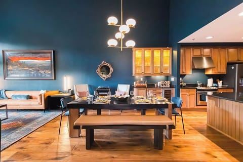 Great Room: 
Dine in elegance with expansive dining options, a wine bar, and the soothing sounds of a Sonos system and modern record player.