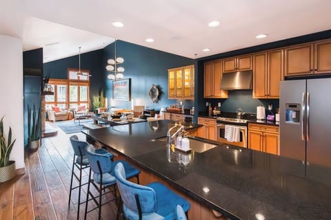 Chef's Kitchen: 
The open-concept kitchen, with custom granite countertops, serves as the hub of laughter, meals, and cherished memories.