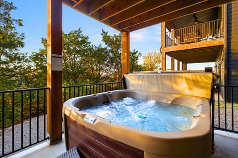Catch the sunset over the lake while soaking in the relaxing hot tub on the back deck.
