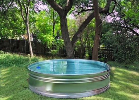 Soak in our cow boy pool in our beautiful Texas garden