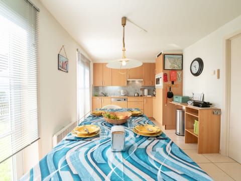 Furniture, Cabinetry, Lighting, Wood, Interior Design, Window, Tablecloth, Clock, Floor, Window Blind