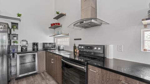 Modern fully equipped kitchen with silver appliances