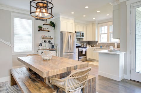 The dining room table in the open concept with the kitchen.