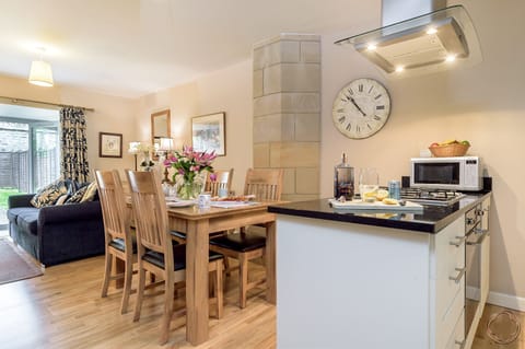 Open plan living area with access to private garden and patio