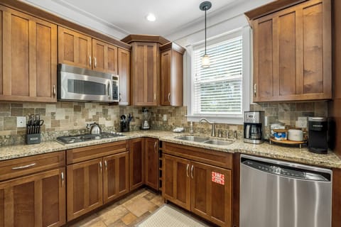 Stainless steel appliances and fully stocked kitchen
