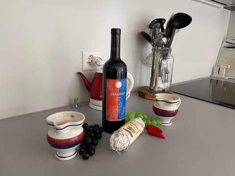 Well-equipped kitchen with coffee maker, dishwasher, microwave and oven.