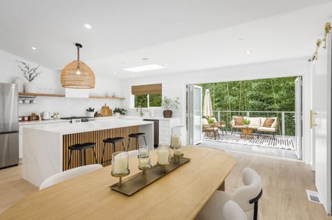 Savor a meal and the fresh air coming through the bifold patio door.