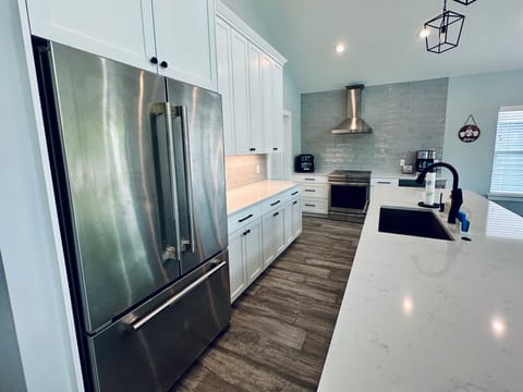 Kitchen features high end, Jenn Air appliances