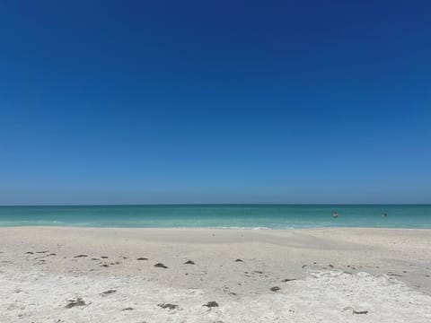 On the beach, sun loungers, beach towels