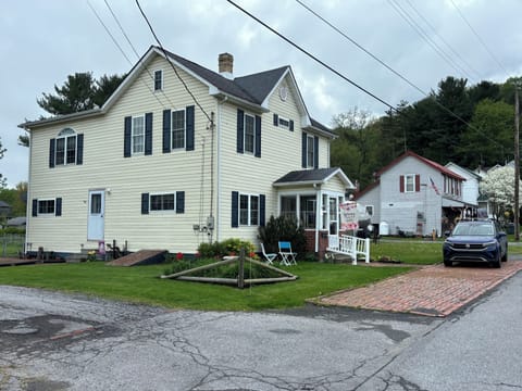 Two additional parking spaces on brick driveway (alley side).