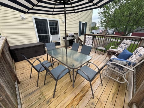 Deck with grill and outdoor eating area (backyard)