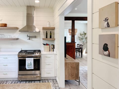 Kitchen opens into living room for open concept living. 