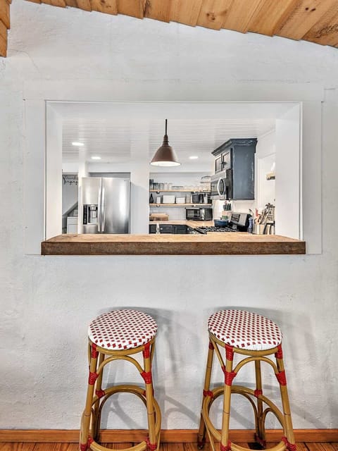 Two barstools looking into kitchen.