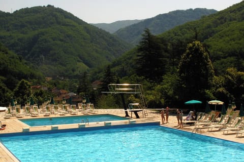 The outdoor pool is 5 mins walk from the apartment in an incredible setting