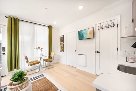 Enjoy meals or a morning coffee at our charming dining nook, bathed in natural light from large windows and adorned with vibrant decor