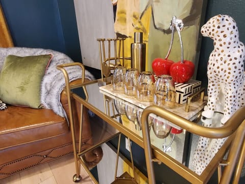 Serve up your favorite drinks with this rolling beverage bar