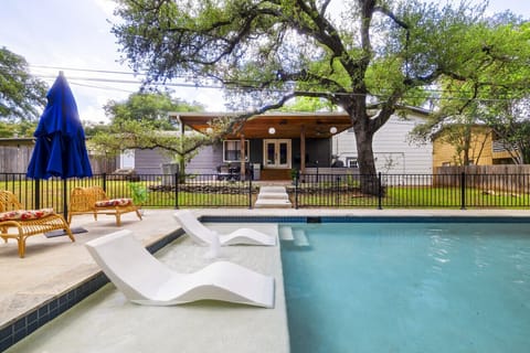 Cool off in the refreshing pool on this spacious 1/2 acre lot