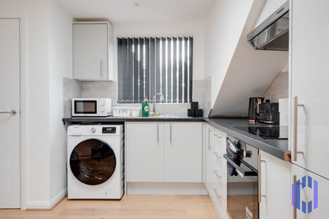 Kitchen. Fully equipped with cooking equipment perfect for families. Appliances such as fridge freezer, microwave, cooker, oven, dishwasher Toaster are free and available for your use.