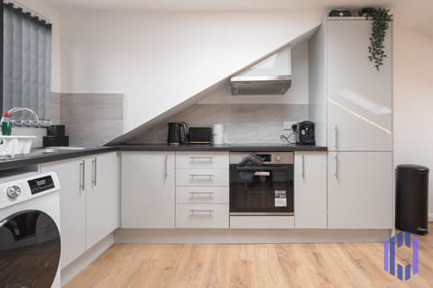 Kitchen. Fully equipped with cooking equipment perfect for families. Appliances such as fridge freezer, microwave, cooker, oven, dishwasher Toaster are free and available for your use.
