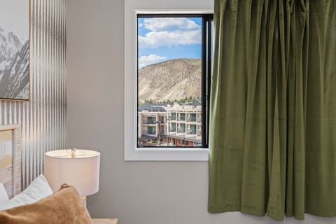 Bedroom 1: King bed with smart TV and views