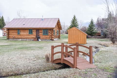 Back yard with irrigation ditch