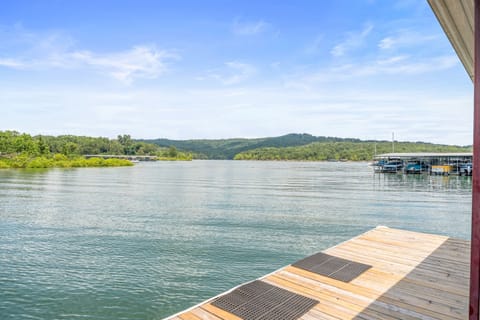 A peaceful retreat by the water, where the dock stretches out to meet the horizon, offering serenity and adventure