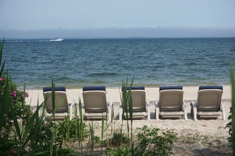 On the beach, sun loungers, beach towels