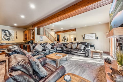 Bonus Room: Large leather couch, 2 chairs, fireplace, 70” TV, wet bar, table w/4 chairs, access to deck and hot tub