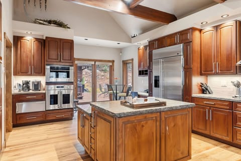 The beautiful kitchen is a chef’s dream with spacious countertops for meal prep and top-of-the-line appliances.
