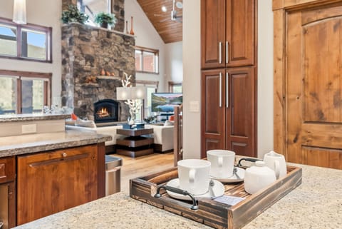 Prepare delicious meals in the fully-equipped kitchen outfitted with top-of-the-line stainless steel appliances and a large center island