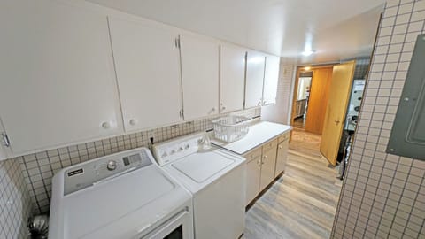 To the left of the entry is the Laundry room which also leads outside.