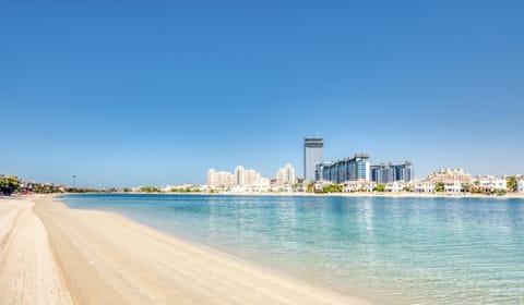 On the beach, sun loungers, beach towels