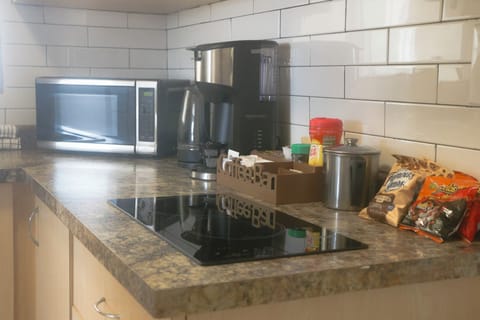 Fridge, microwave, stovetop, coffee/tea maker