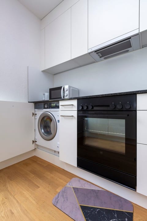 Washing machine in the apartment equipped with dryer function for our guests exclusive use.