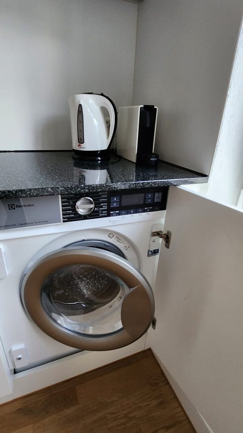 Washing machine in the apartment equipped with dryer function for our guests exclusive use.