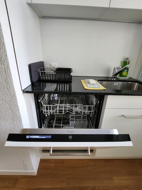 Apartment is equipped with a V-Zug dishwasher in the kitchen.