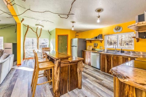 A custom and fully stocked black walnut kitchen is perfect for groups, sustainably made by the owners from a local fallen tree.
