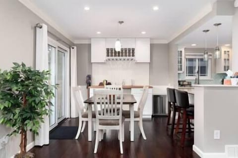 The dining table seats four and there is seating for another two at the counter.