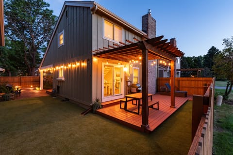 Enjoy a beautiful summer evening outdoors with the well lit dining area on the back deck. 