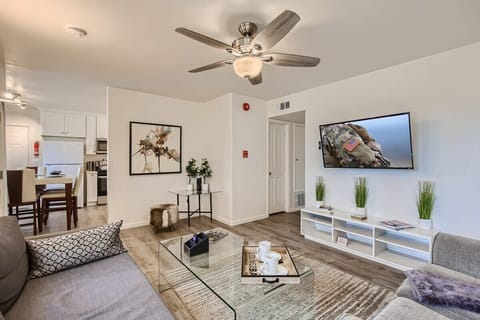 Walk into a Sophisticated living room design with two sofas that open up to full-size beds, 60” Smart TV, full-length mirrors, beautiful decor, and much more.