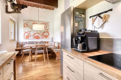 Kitchen with dining table in the Hämmerle house in Damüls in the Bregenzerwald.