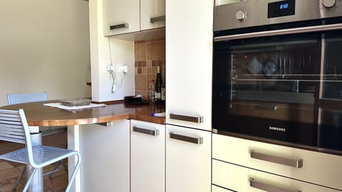 Fridge, oven, dishwasher, dining tables