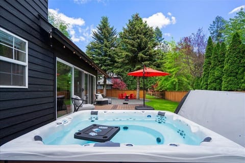 Easily step down into the 9-person hot tub from the south deck and sitting area.