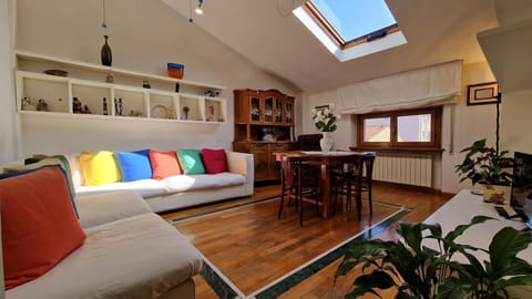 Stylish living room with wooden and marble floor. A wonderful part of an apartment in the center of Viareggio just 50 meters from the sea