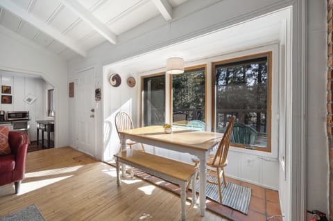 Enjoy the dining nook area with beautiful forest views